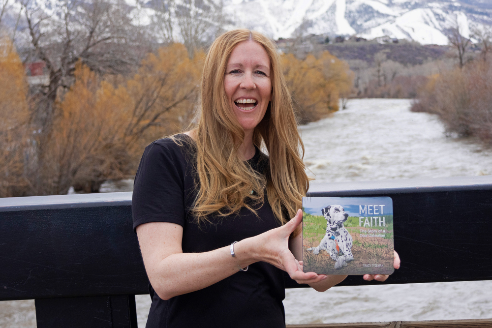 Tracy Tydeman with her book Meet Faith - The Story of a Deaf Dalmatian